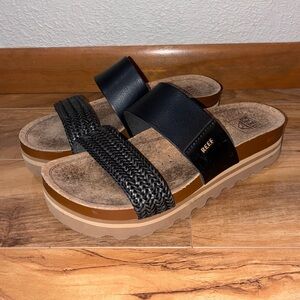 Reef Women's Cushion Vista Hi Sandal, Black Braid - size 7